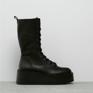 Black flat platform leather boots. Mid calf. Brand new with tags. Retails $129